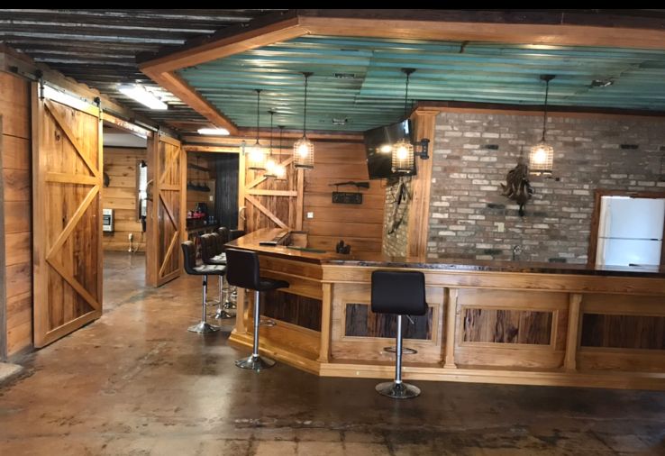 Delta Outdoors Co. lodge bar area with wood counters and seating for guests.
