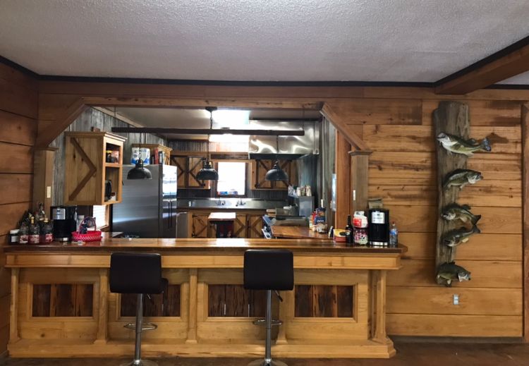 Delta Outdoors Co. lodge bar and kitchen pass-through area used for guest meal service.