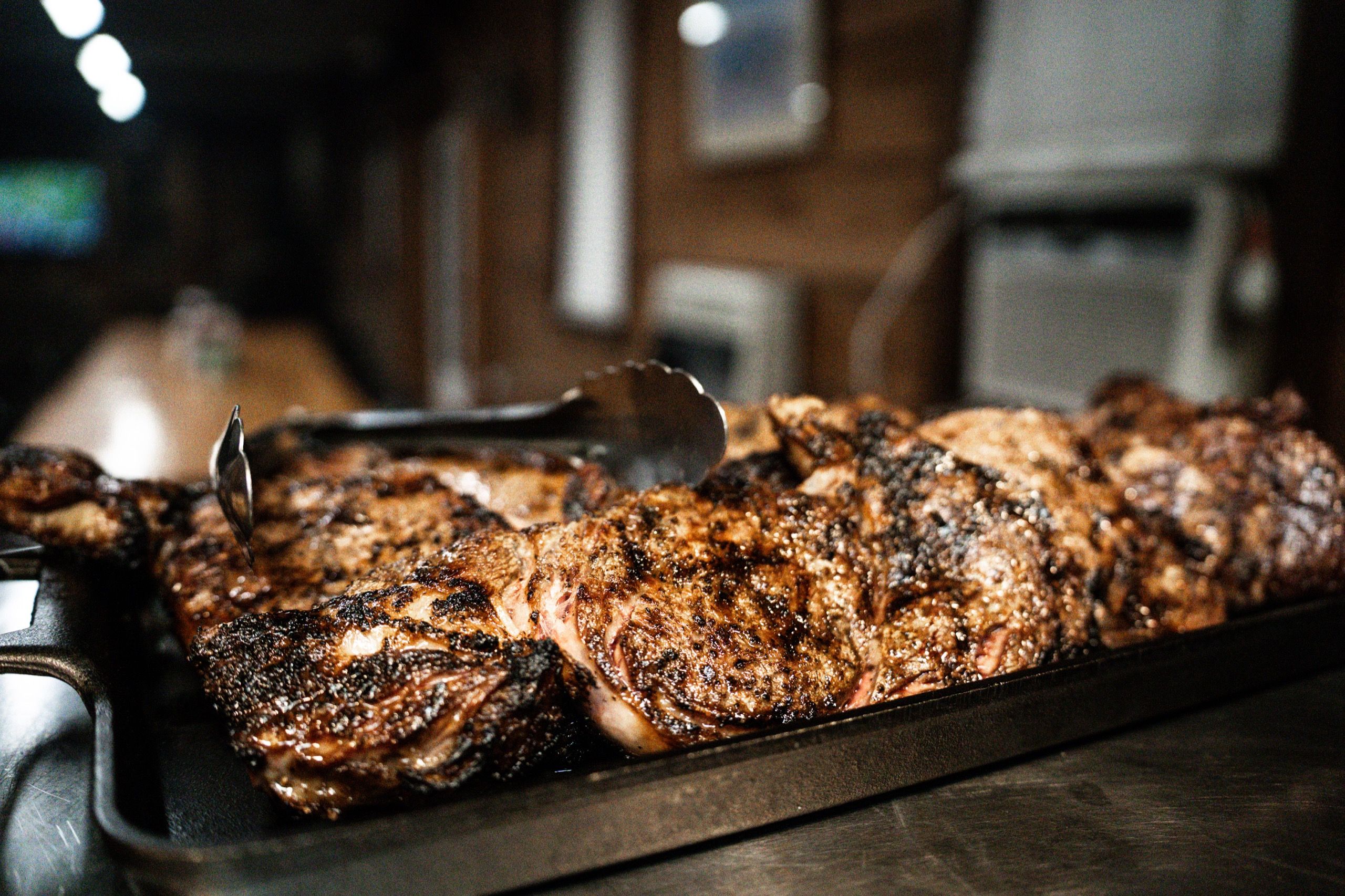 Grilled steak plated for guests during Delta Outdoors Co. lodge dinner service.