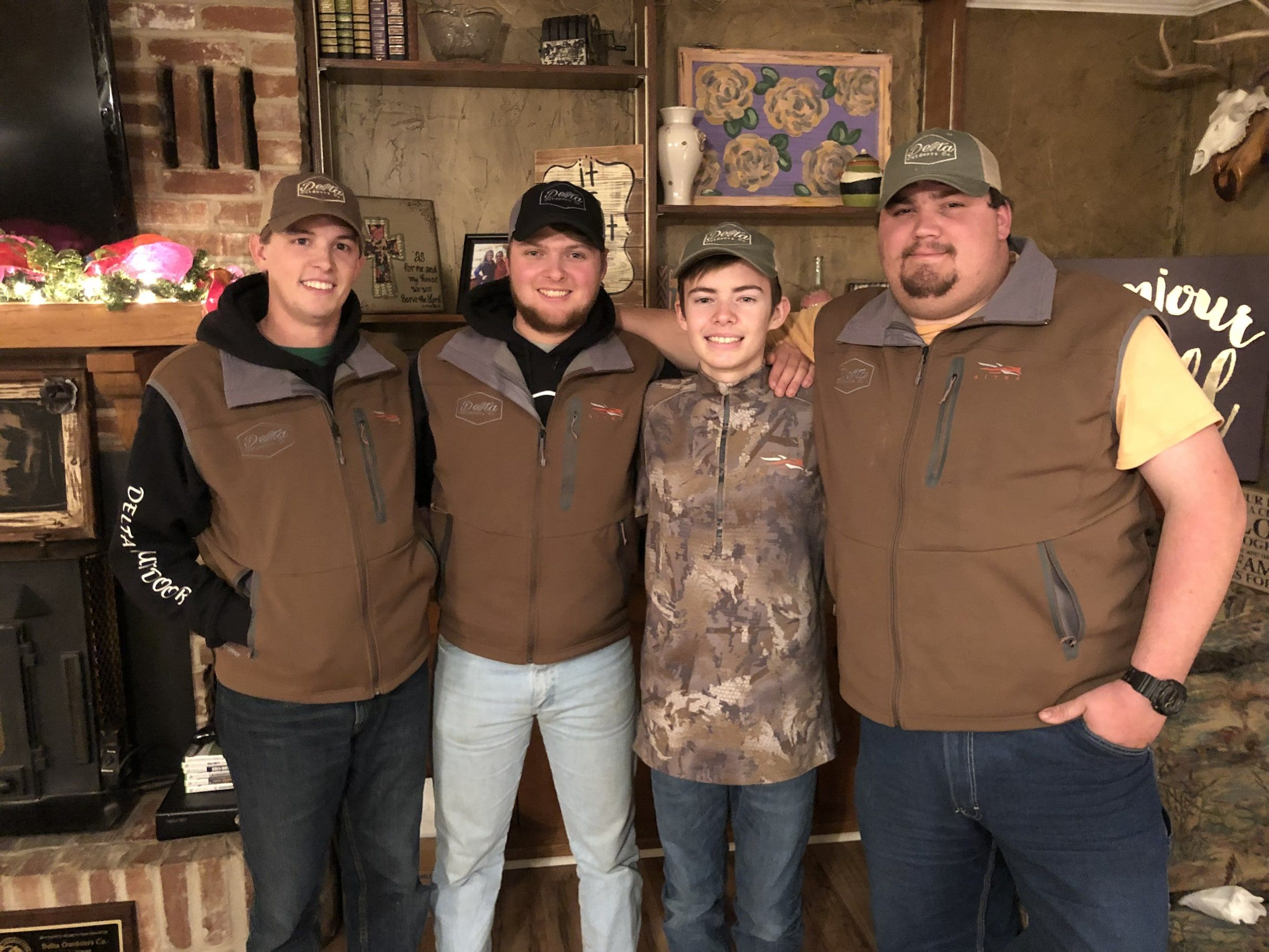 Early Delta Outdoors crew members gathered together inside camp.